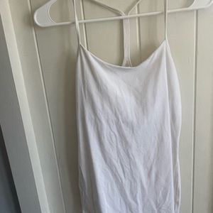 White lululemon workout top with thing straps